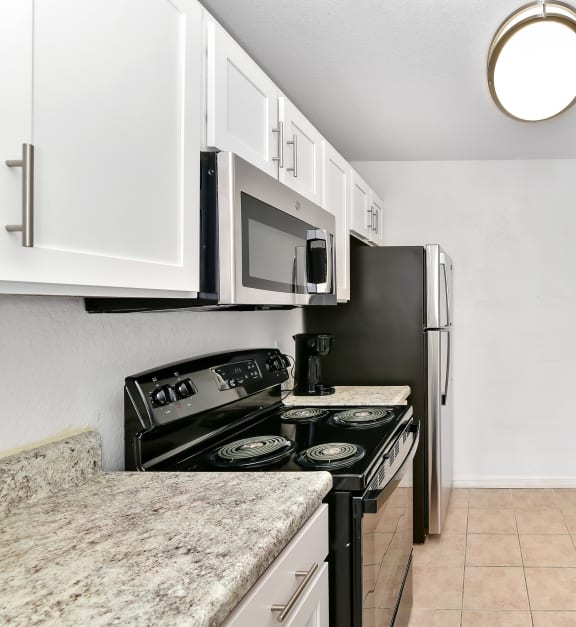 kitchen with white cabinets at Village Lakes, Orlando, FL, 32808
